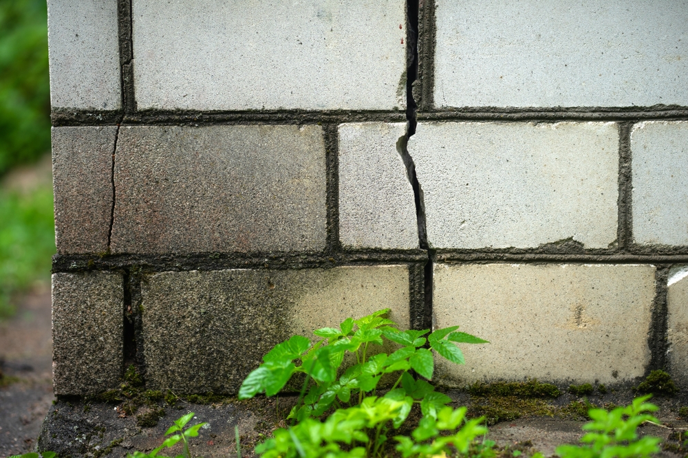 A,Crack,In,The,Brick,Foundation,Of,The,Building.,Repair
